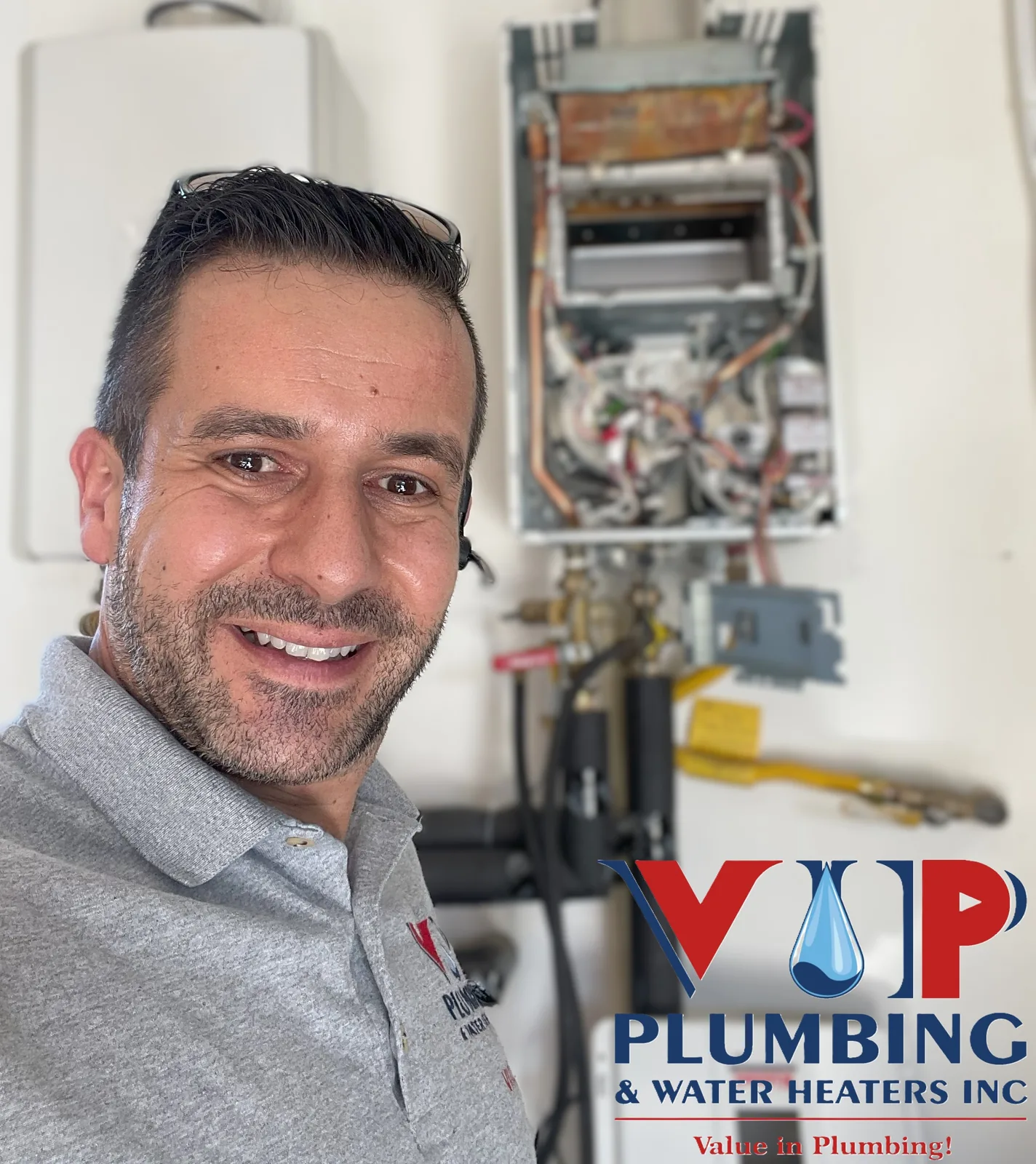 Vince, owner of VIP Plumbing & Water Heaters Inc, servicing a tankless water heater